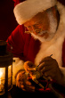 ist1_10605978-antique-photo-of-santa-claus-painting-a-toy-by-lantern
